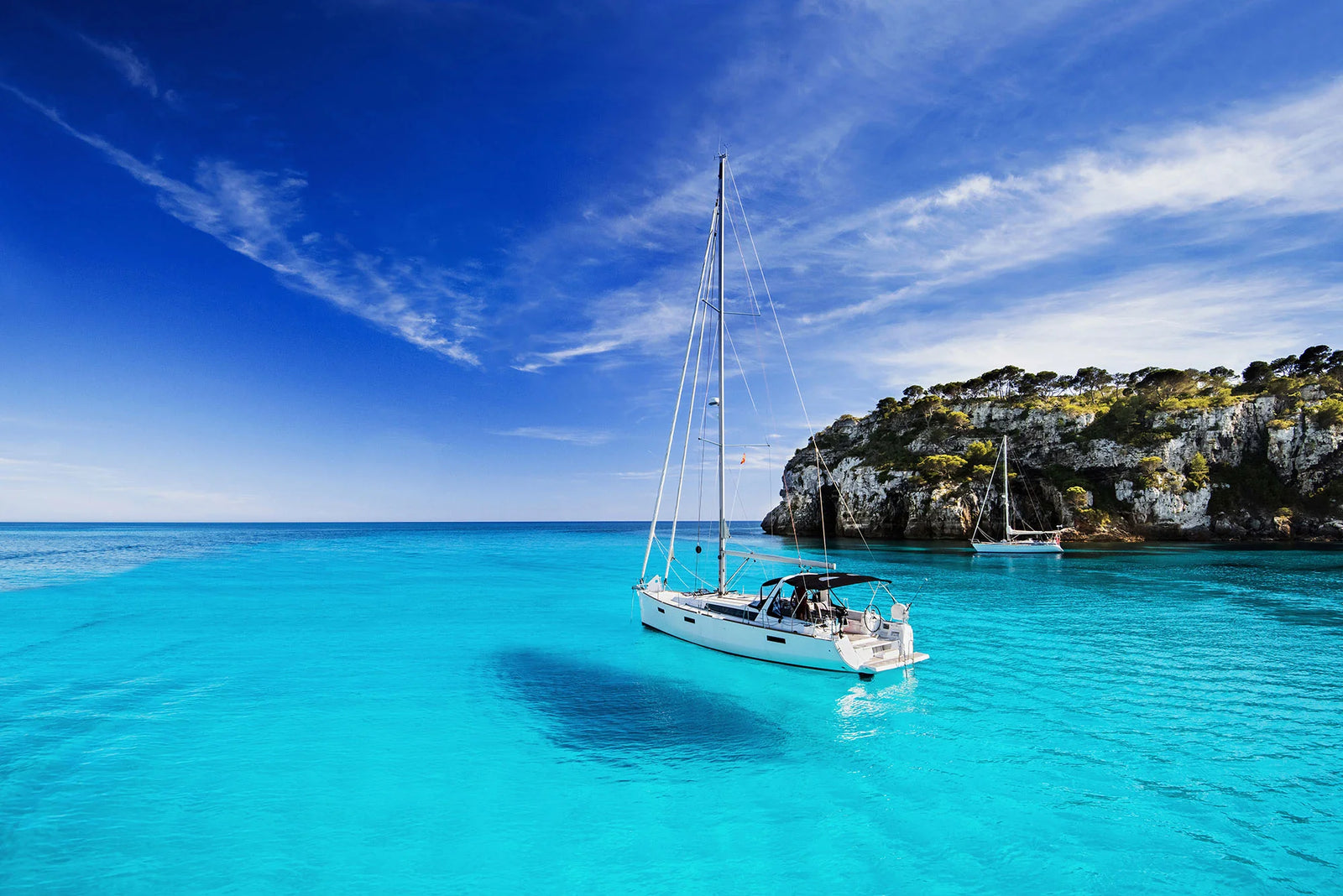 Sailboat in a bright blue bay