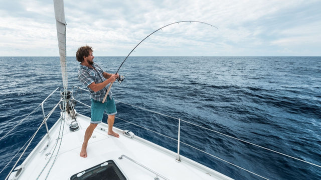 Man Fishing off a Boat