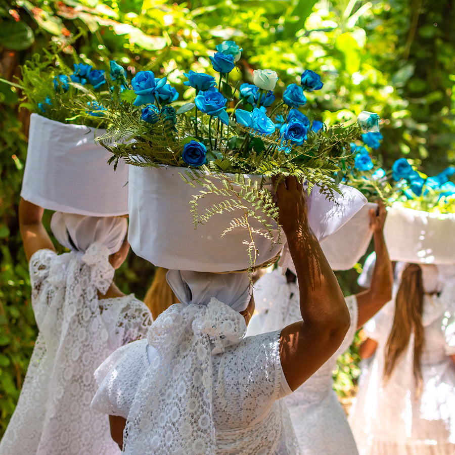 Women carrying flowers