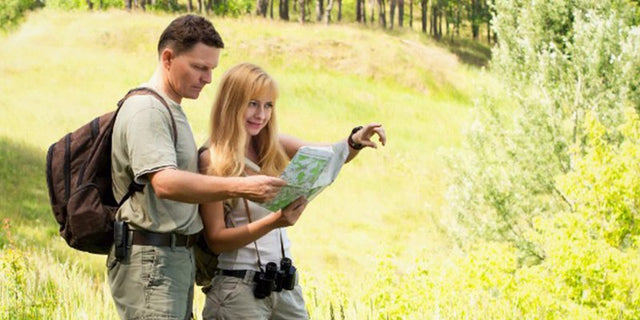 Man and woman reading a map