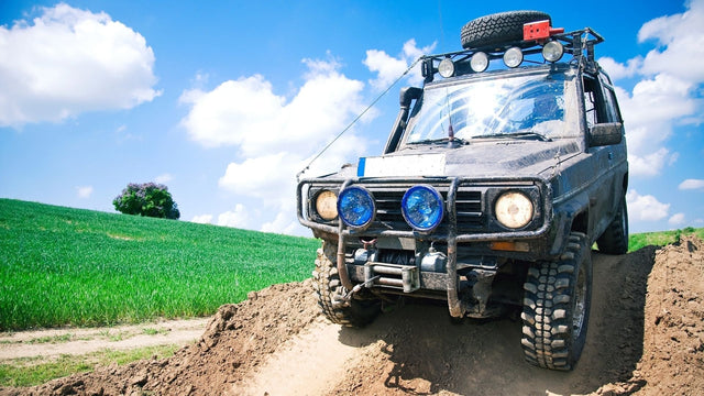 Offroading vehicle on dirt road