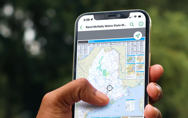 Person holding a phone that displays Rand Mcnally's Maine map