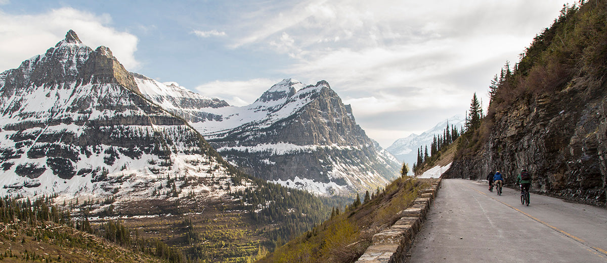 Bikers cycling in Glacier National Park