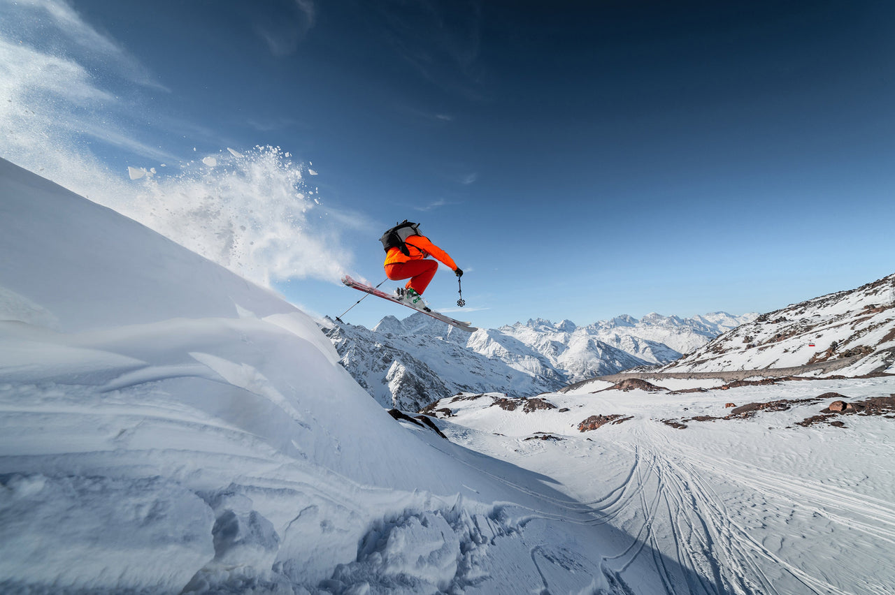 A man skiing down a mountain slope