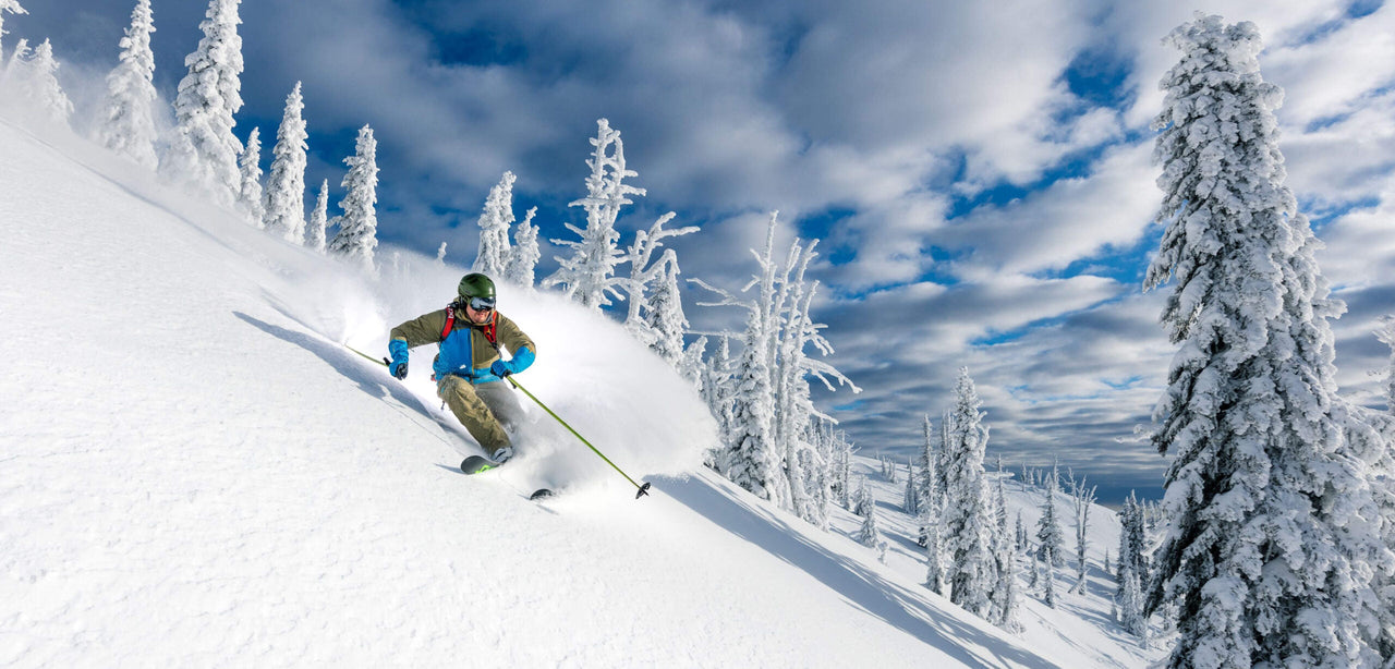 A man skiing down a mountain slope