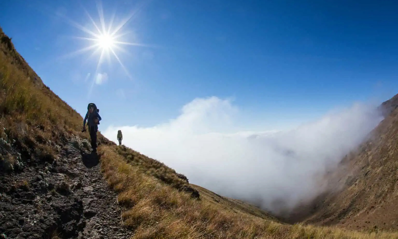 People hiking Drakensberg Traverse in South Africa