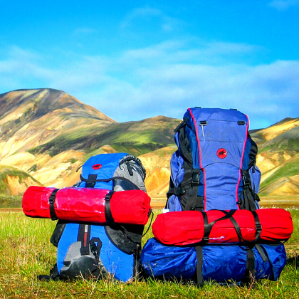 Two backpacks in a mountain landscape