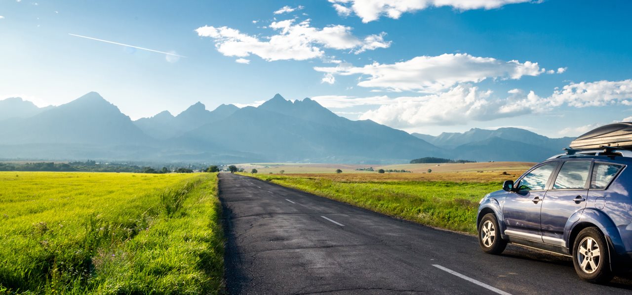 Car on the road with the mountain views