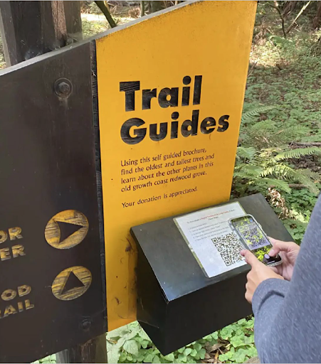 Scanning a QR code at a trail to get the Avenza Map