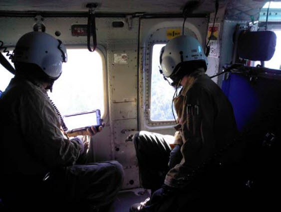 United States Forest Services workers in a helipcopter