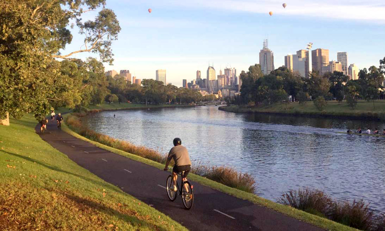 People biking along the Yarra River